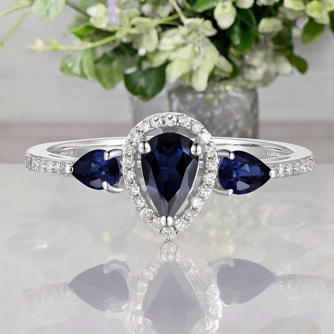 10K Genuine Sapphire & 1/10 ct tw Diamond 3-Stone Pear Ring