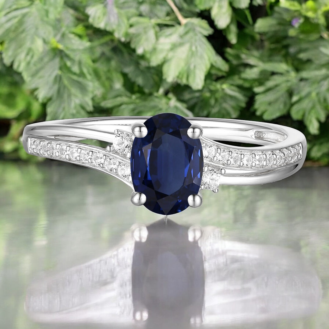 10K Genuine Sapphire & 1/10 ct tw Diamond Oval By-pass Ring